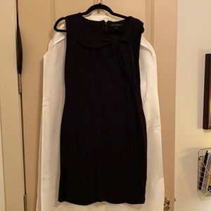 Black cocktail dress with bow detail
